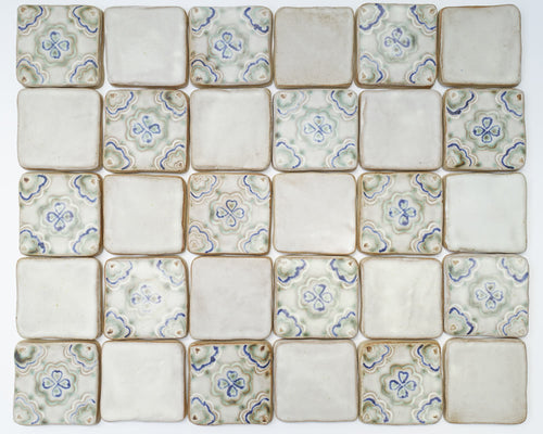 Geometric tile pattern with floral designs on a white background
