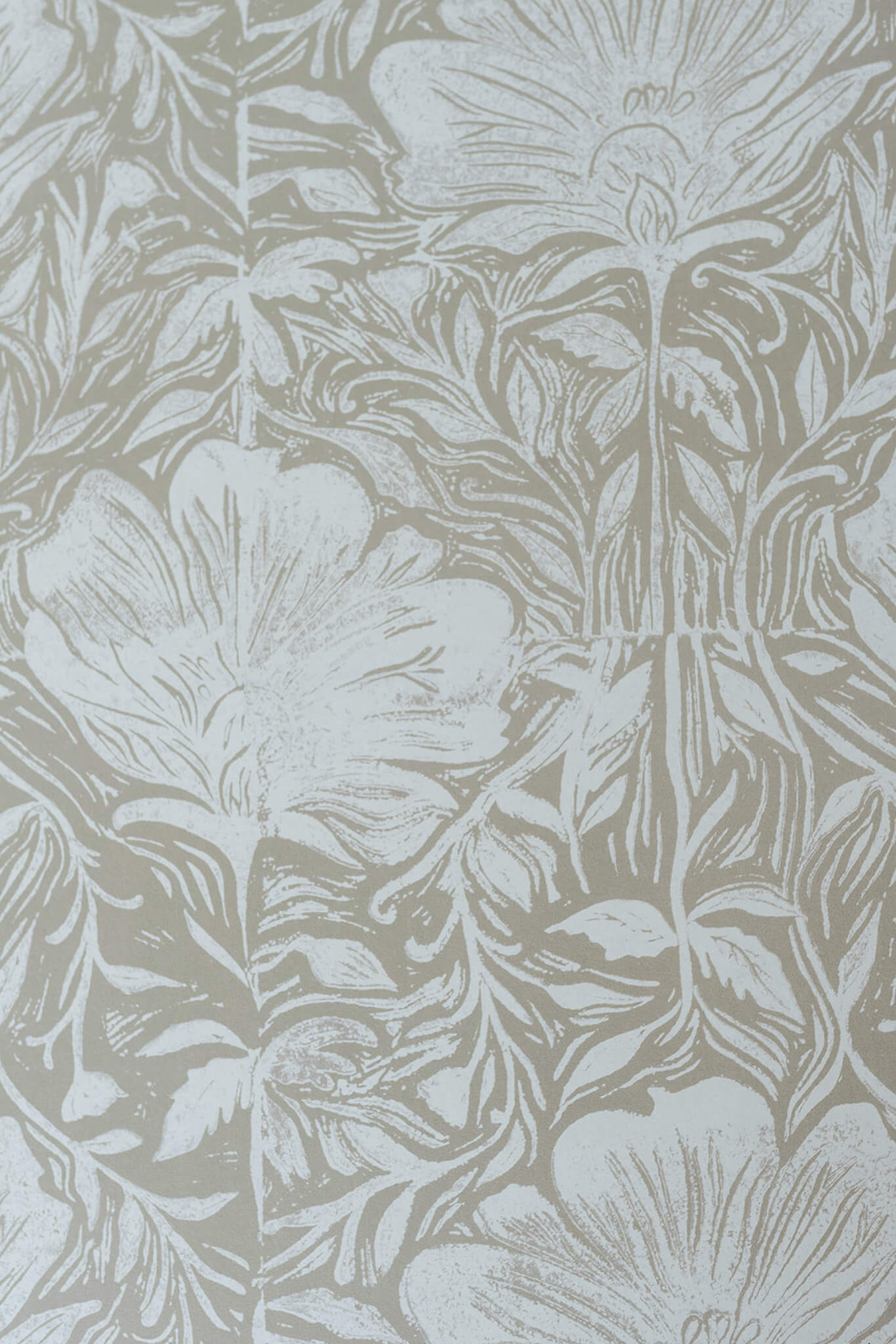 Floral wallpaper pattern in a light colour on a textured background